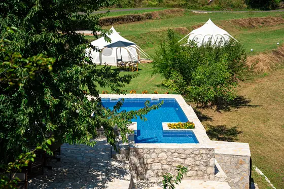 Pool, gardens and mountain views at Zen Relaxing Village glamping resort, Montenegro